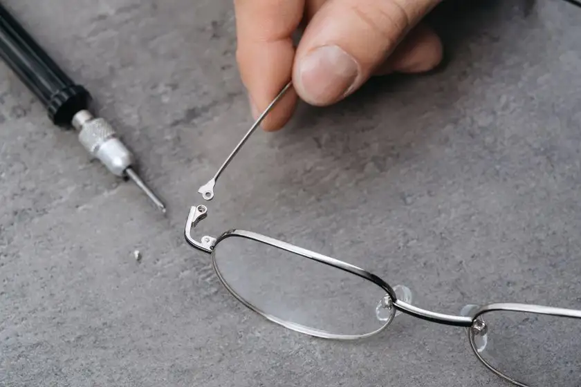 Optometrist Fixing Glasses